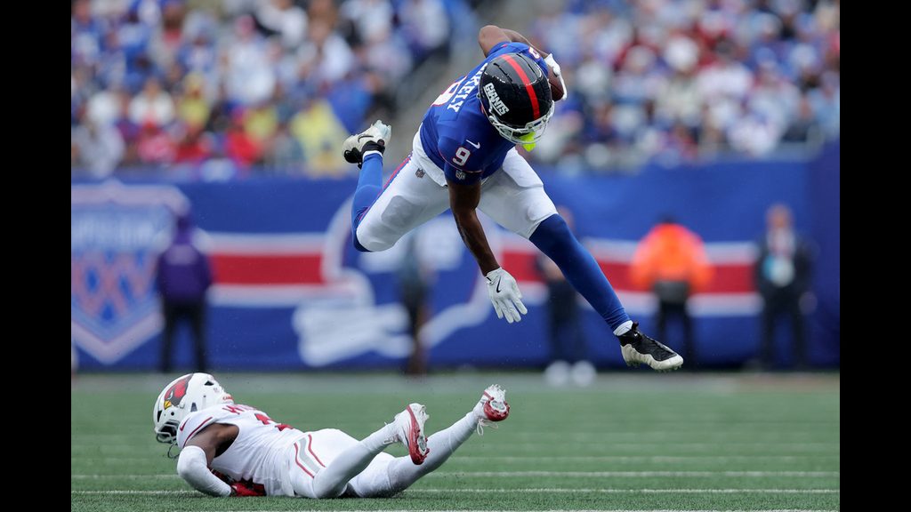 Isaiah Likely jumps over Cardinals cornerback Garrett Williams in a NFL week four win over the Arizone Cardinals