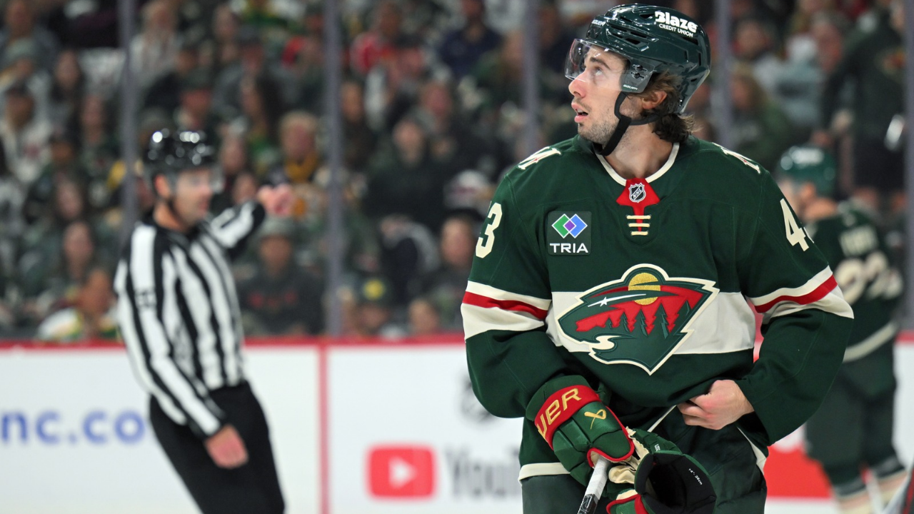 Oct 3, 2026; Saint Paul, Minnesota, USA; Minnesota Wild defensemen Quinn Hughes (43) watches a replay on the scoreboard after a whistle against the Boston Bruins during the second period at Grand Casino Arena. Mandatory Credit: Nick Wosika-Imagn Images