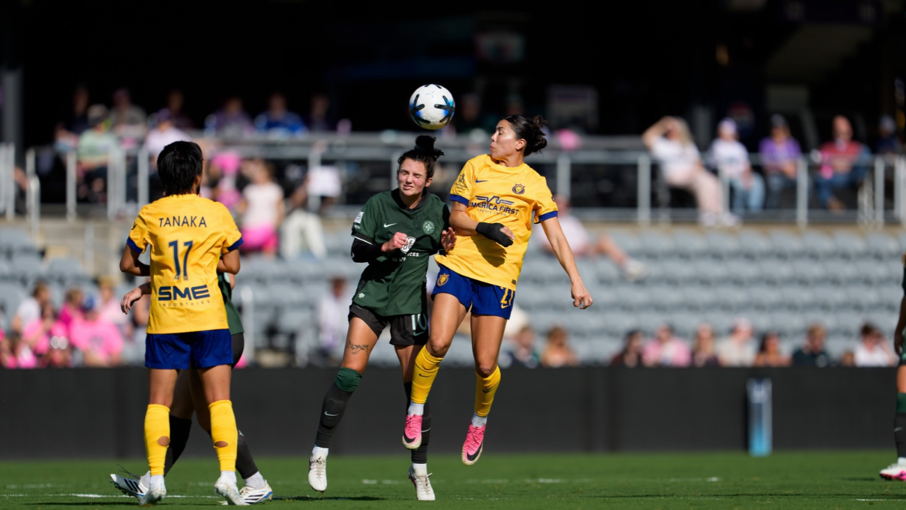 Oct 3, 2026; Louisville, Kentucky, USA; Racing Louisville FC midfielder Macey Hodge (10) and Utah Royals FC forward Kiana Palacios (21) fight for the ball in the first half at Lynn Family Stadium. Mandatory Credit: EM Dash-Imagn Images